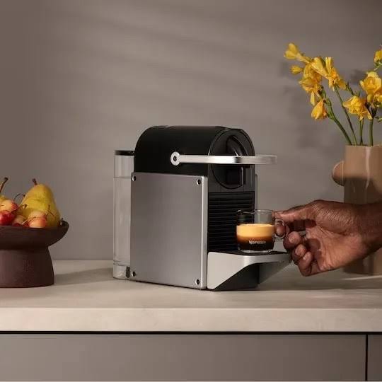 Technician repairing a Nespresso capsule coffee machine in Nairobi