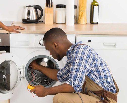 a man repairing washing machine in Nairobi